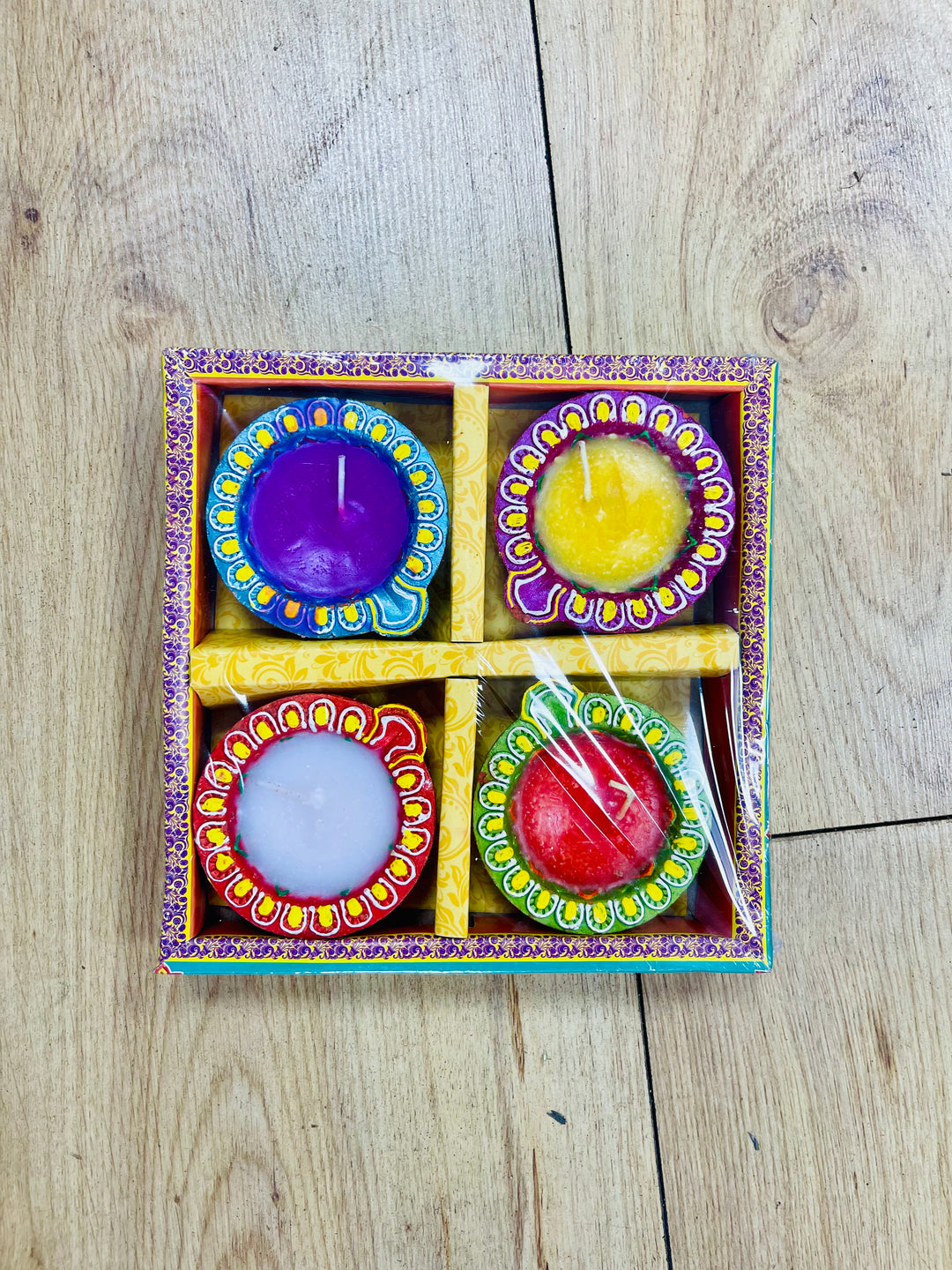 Festive clay diyas with wax (Pattern and colors may vary from the image)